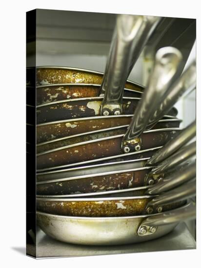 A Pile of Frying Pans in a Commercial Kitchen-Herbert Lehmann-Stretched Canvas