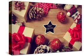 A Pile of Gifts and Christmas Ornaments, such as Christmas Balls and Stars, on a Rustic Wooden Tabl-nito-Stretched Canvas