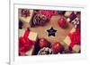 A Pile of Gifts and Christmas Ornaments, such as Christmas Balls and Stars, on a Rustic Wooden Tabl-nito-Framed Premium Photographic Print