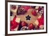 A Pile of Gifts and Christmas Ornaments, such as Christmas Balls and Stars, on a Rustic Wooden Tabl-nito-Framed Premium Photographic Print