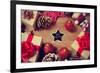 A Pile of Gifts and Christmas Ornaments, such as Christmas Balls and Stars, on a Rustic Wooden Tabl-nito-Framed Premium Photographic Print