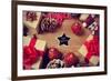 A Pile of Gifts and Christmas Ornaments, such as Christmas Balls and Stars, on a Rustic Wooden Tabl-nito-Framed Photographic Print