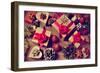 A Pile of Gifts and Christmas Ornaments, such as Christmas Balls, Stars and Tinsel, on a Rustic Woo-nito-Framed Photographic Print