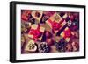 A Pile of Gifts and Christmas Ornaments, such as Christmas Balls, Stars and Tinsel, on a Rustic Woo-nito-Framed Photographic Print