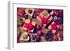 A Pile of Gifts and Christmas Ornaments, such as Christmas Balls, Stars and Tinsel, on a Rustic Woo-nito-Framed Photographic Print