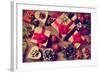 A Pile of Gifts and Christmas Ornaments, such as Christmas Balls, Stars and Tinsel, on a Rustic Woo-nito-Framed Photographic Print