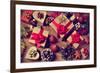 A Pile of Gifts and Christmas Ornaments, such as Christmas Balls, Stars and Tinsel, on a Rustic Woo-nito-Framed Photographic Print