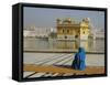 A Pilgrim in Blue Sits by the Holy Pool of Nectar at the Golden Temple, Punjab, India-Jeremy Bright-Framed Stretched Canvas