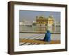 A Pilgrim in Blue Sits by the Holy Pool of Nectar at the Golden Temple, Punjab, India-Jeremy Bright-Framed Photographic Print