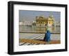 A Pilgrim in Blue Sits by the Holy Pool of Nectar at the Golden Temple, Punjab, India-Jeremy Bright-Framed Photographic Print