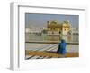 A Pilgrim in Blue Sits by the Holy Pool of Nectar at the Golden Temple, Punjab, India-Jeremy Bright-Framed Photographic Print