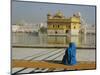 A Pilgrim in Blue Sits by the Holy Pool of Nectar at the Golden Temple, Punjab, India-Jeremy Bright-Mounted Photographic Print