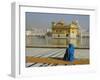 A Pilgrim in Blue Sits by the Holy Pool of Nectar at the Golden Temple, Punjab, India-Jeremy Bright-Framed Photographic Print