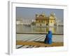 A Pilgrim in Blue Sits by the Holy Pool of Nectar at the Golden Temple, Punjab, India-Jeremy Bright-Framed Photographic Print