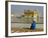 A Pilgrim in Blue Sits by the Holy Pool of Nectar at the Golden Temple, Punjab, India-Jeremy Bright-Framed Photographic Print