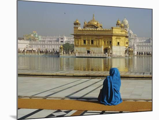 A Pilgrim in Blue Sits by the Holy Pool of Nectar at the Golden Temple, Punjab, India-Jeremy Bright-Mounted Photographic Print