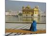 A Pilgrim in Blue Sits by the Holy Pool of Nectar at the Golden Temple, Punjab, India-Jeremy Bright-Mounted Photographic Print