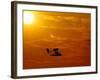 A Pilot Flies a Small Plane Past the Setting Sun Over Lake Winnipesaukee-null-Framed Photographic Print