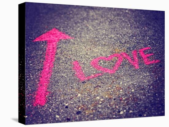 A Pink Arrow Showing the Way to Love Written on a Sidewalk with Chalk Toned with a Retro Vintage In-graphicphoto-Stretched Canvas