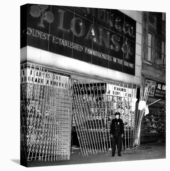 A Policeman Stands in Front of a Pawn Shop-null-Stretched Canvas