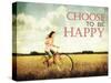 A Pretty Girl Riding through a Field Full of Yellow Flowers with the Text: Choose to Be Happy-graphicphoto-Stretched Canvas