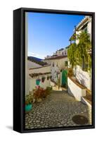 A pretty street in 17th century Acebuchal in the Sierras of Tejeda, Andlaucia, Spain, sits on a...-Panoramic Images-Framed Stretched Canvas