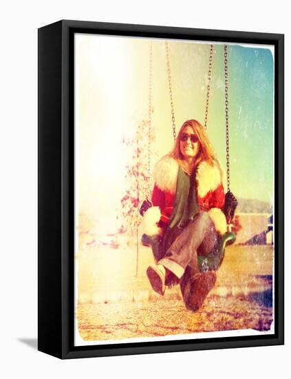 A Pretty Woman Sitting in a Swing-graphicphoto-Framed Stretched Canvas