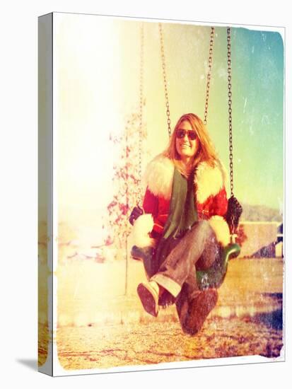 A Pretty Woman Sitting in a Swing-graphicphoto-Stretched Canvas