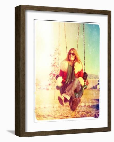 A Pretty Woman Sitting in a Swing-graphicphoto-Framed Photographic Print