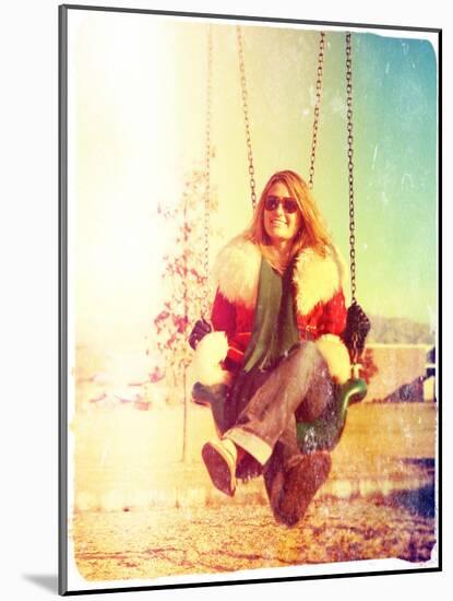 A Pretty Woman Sitting in a Swing-graphicphoto-Mounted Photographic Print