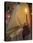 A Priest's Hand Holding a Candle During Mass in Easter Week, Old City, Israel-Eitan Simanor-Stretched Canvas