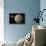 A Probe Investigating a Heavily Cratered Moon in Deep Space-null-Stretched Canvas displayed on a wall