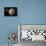 A Probe Investigating a Heavily Cratered Moon in Deep Space-null-Framed Stretched Canvas displayed on a wall