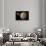 A Probe Investigating a Heavily Cratered Moon in Deep Space-null-Framed Stretched Canvas displayed on a wall