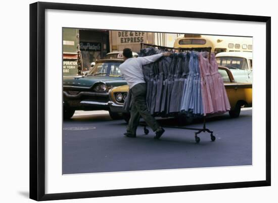 A Push Boy Steers a Rack of Dresses across an Intersection, New York, New York, 1960-Walter Sanders-Framed Photographic Print