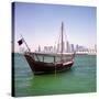 A Qatari Sailing Dhow, Called a Boom or Boum, with the National Flag Flying and the Doha Skyline-PaulCowan-Stretched Canvas