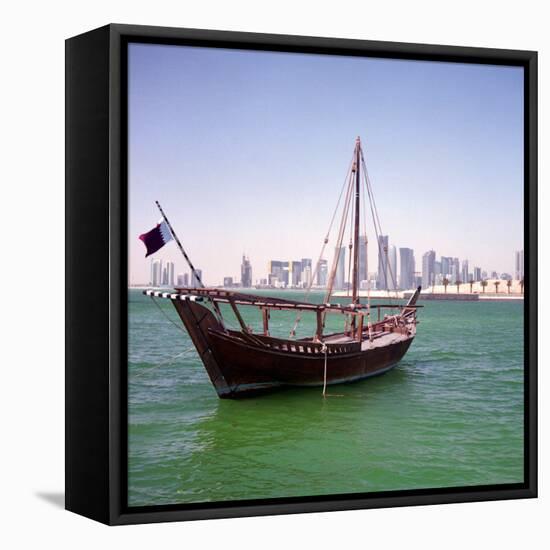 A Qatari Sailing Dhow, Called a Boom or Boum, with the National Flag Flying and the Doha Skyline-PaulCowan-Framed Stretched Canvas