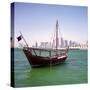 A Qatari Sailing Dhow, Called a Boom or Boum, with the National Flag Flying and the Doha Skyline-PaulCowan-Stretched Canvas