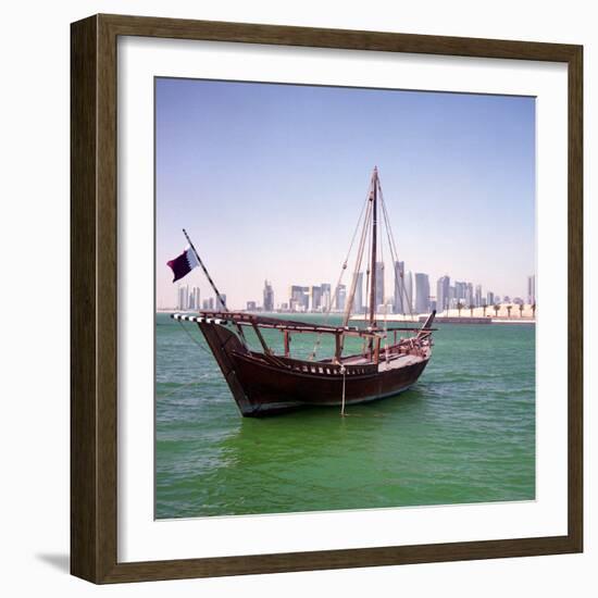 A Qatari Sailing Dhow, Called a Boom or Boum, with the National Flag Flying and the Doha Skyline-PaulCowan-Framed Photographic Print