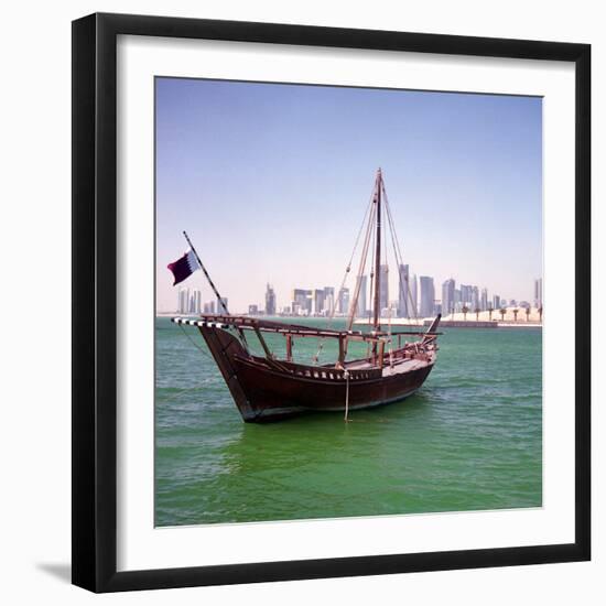 A Qatari Sailing Dhow, Called a Boom or Boum, with the National Flag Flying and the Doha Skyline-PaulCowan-Framed Photographic Print