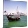 A Qatari Sailing Dhow, Called a Boom or Boum, with the National Flag Flying and the Doha Skyline-PaulCowan-Mounted Photographic Print