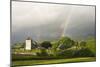 A Rainbow over St. David's Church in the Tiny Welsh Hamlet of Llanddewir Cwm, Powys, Wales-Graham Lawrence-Mounted Photographic Print