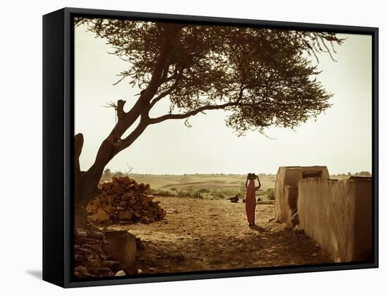 A Rajasthani Woman Carries Her Things on Her Head in a Small Village in Western Rajasthan-D. Scott Clark-Framed Stretched Canvas