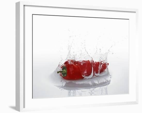 A Red Chilli Pepper Falling into Water-Kröger & Gross-Framed Photographic Print