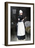 A Red Cross Hospital nurse Pouring Medicine, Late 1800s-null-Framed Giclee Print