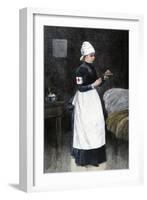 A Red Cross Hospital nurse Pouring Medicine, Late 1800s-null-Framed Giclee Print