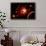 A Red Giant Star System-null-Framed Art Print displayed on a wall