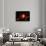 A Red Giant Star System-null-Framed Art Print displayed on a wall