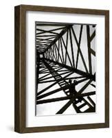 A Reenactor is Silhouetted Inside a Replica of the Spindletop Oil Derrick-null-Framed Photographic Print