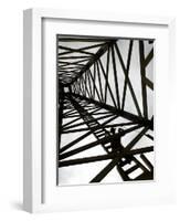 A Reenactor is Silhouetted Inside a Replica of the Spindletop Oil Derrick-null-Framed Photographic Print